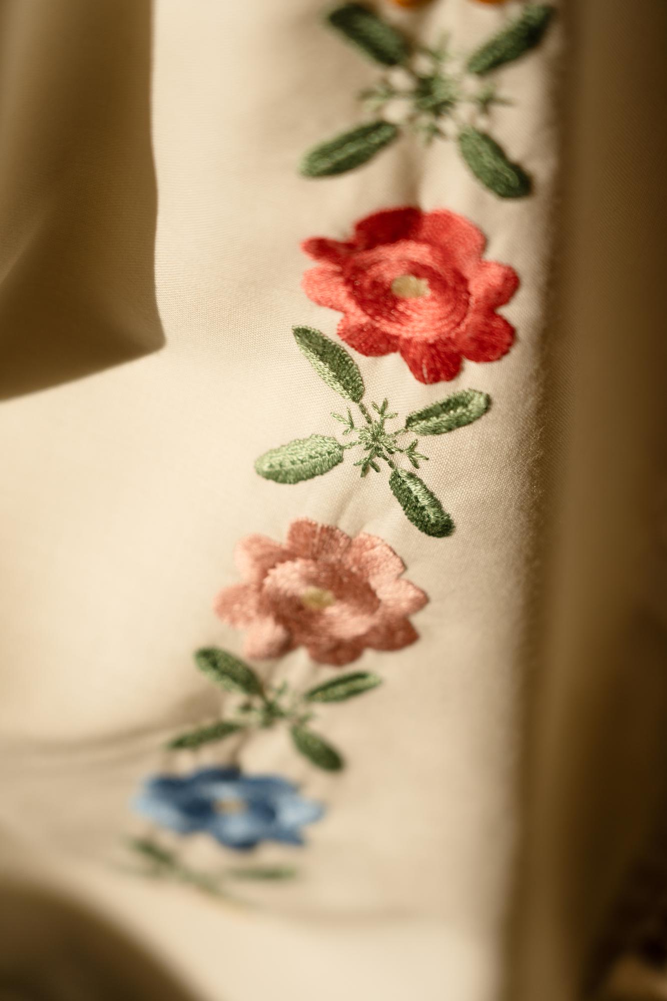 close-up of textured floral embroidery on linen